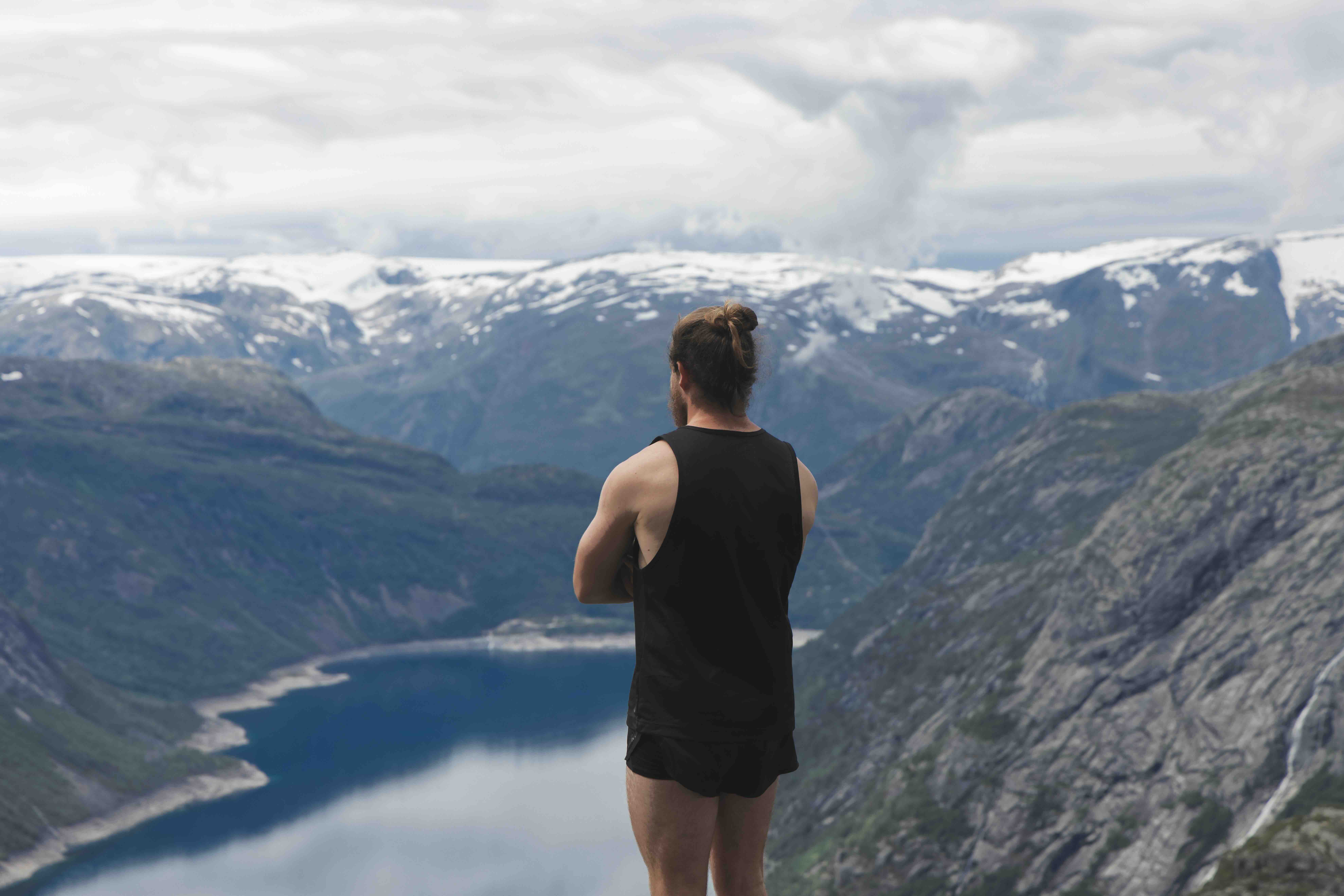 Figure overlooking a Norwegian fjord